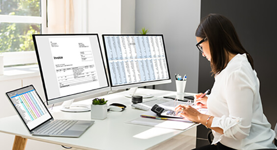 woman manually creating internal audit reporting