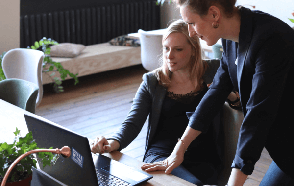 women leaders happily reviewing automation ROI